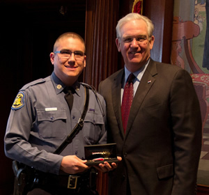 Gov. Jay Nixon presents the 2013 Medal of Valor to Highway Patrol Trooper Jason W. Philpott.